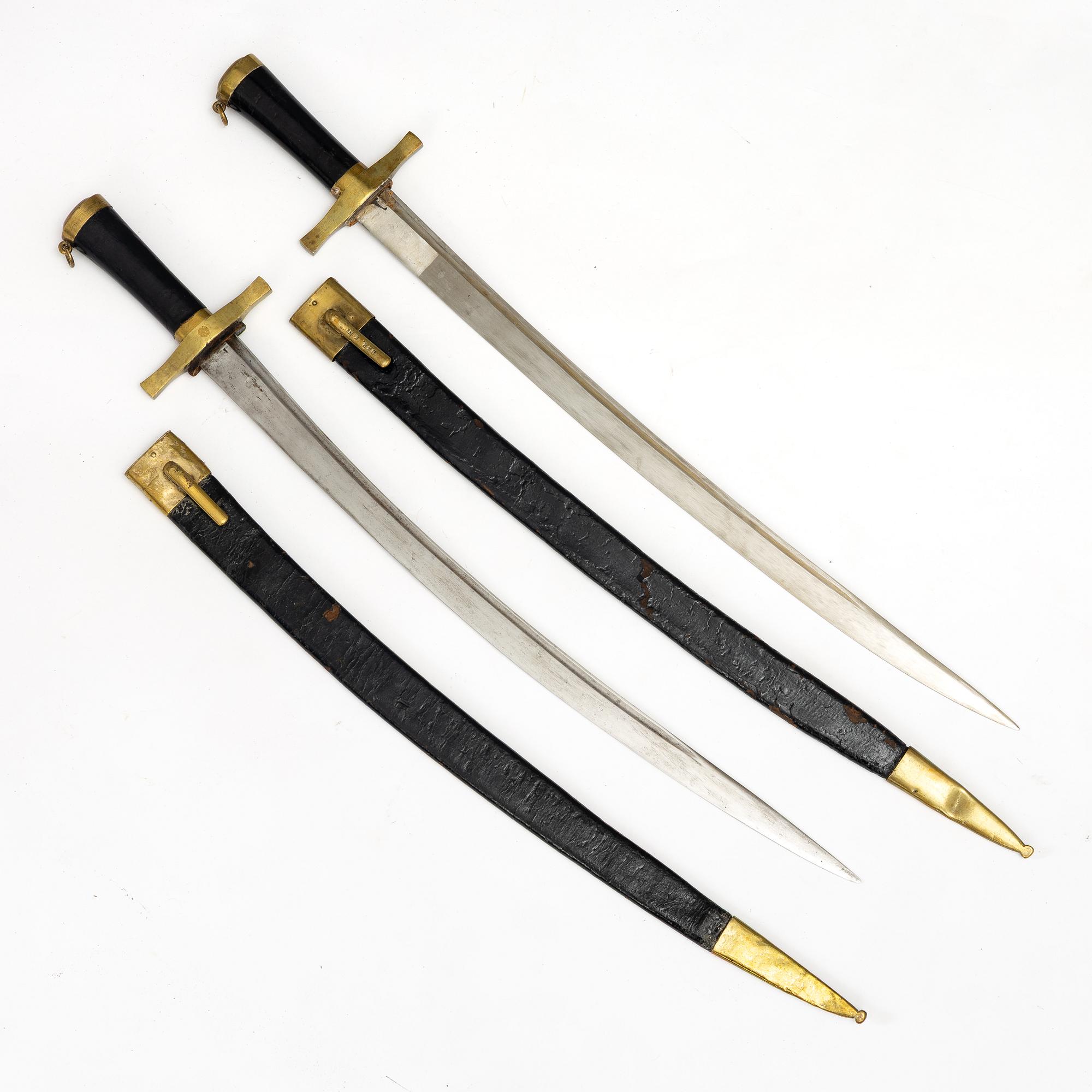 Two Swedish cutlasses 1856 pattern, with scabbards.