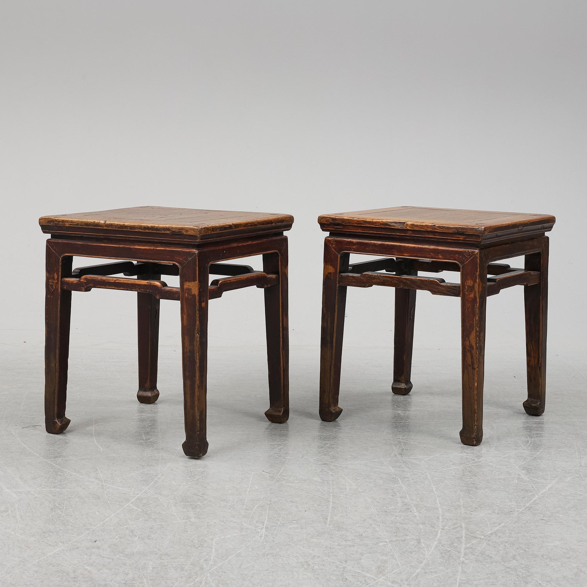 A pair of hardwood tables, 20th century.