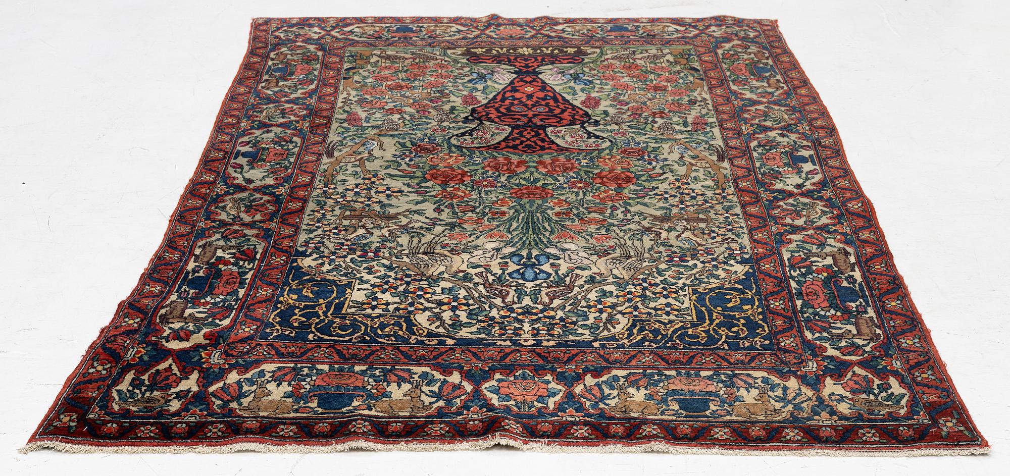 A figural oriental rug, c.. 230 x 130 cm.
