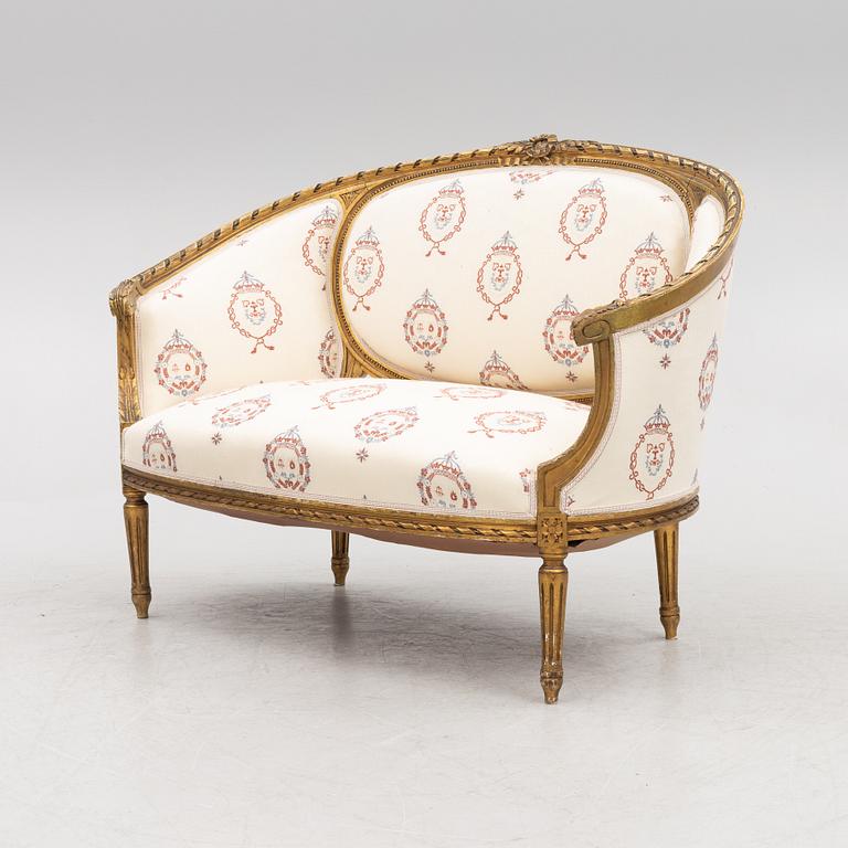 A Gustavian style sofa with two armchairs and two chairs, 20th century.