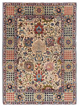389. A signed semi-antique Tabriz rug, ca 198 x 142 cm.