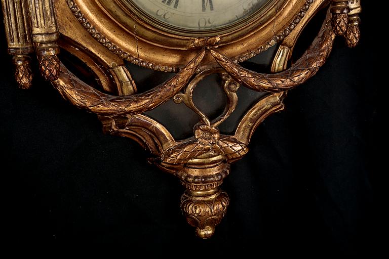 A Gustavian wall hanged clock, dial marked "Jacob Kock Stockholm", maded in the second half of the 18th century.