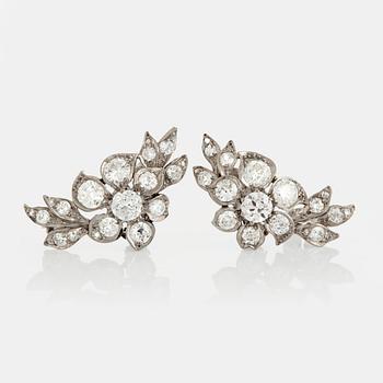 1091. A pair of earrings set with old-cut diamonds.