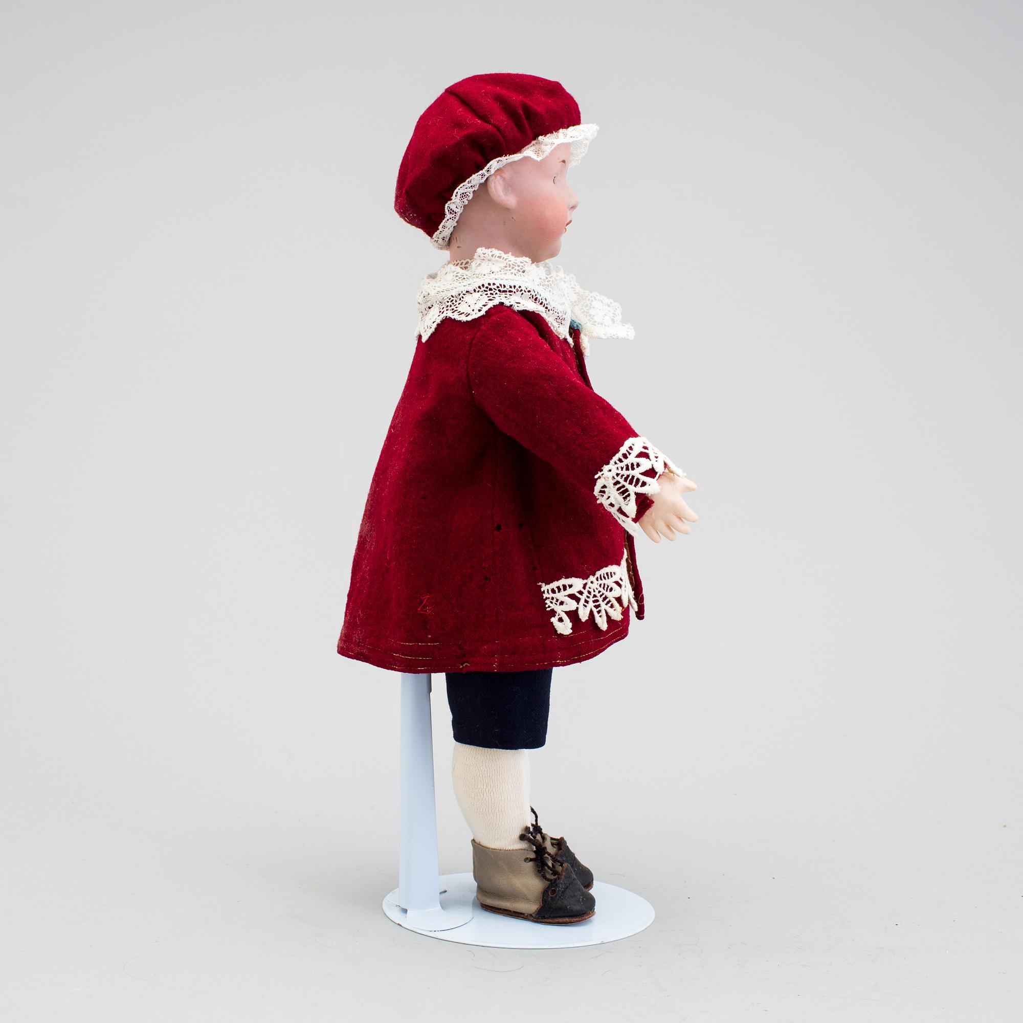 A bisque headed character boy doll, Germany, 1910s.