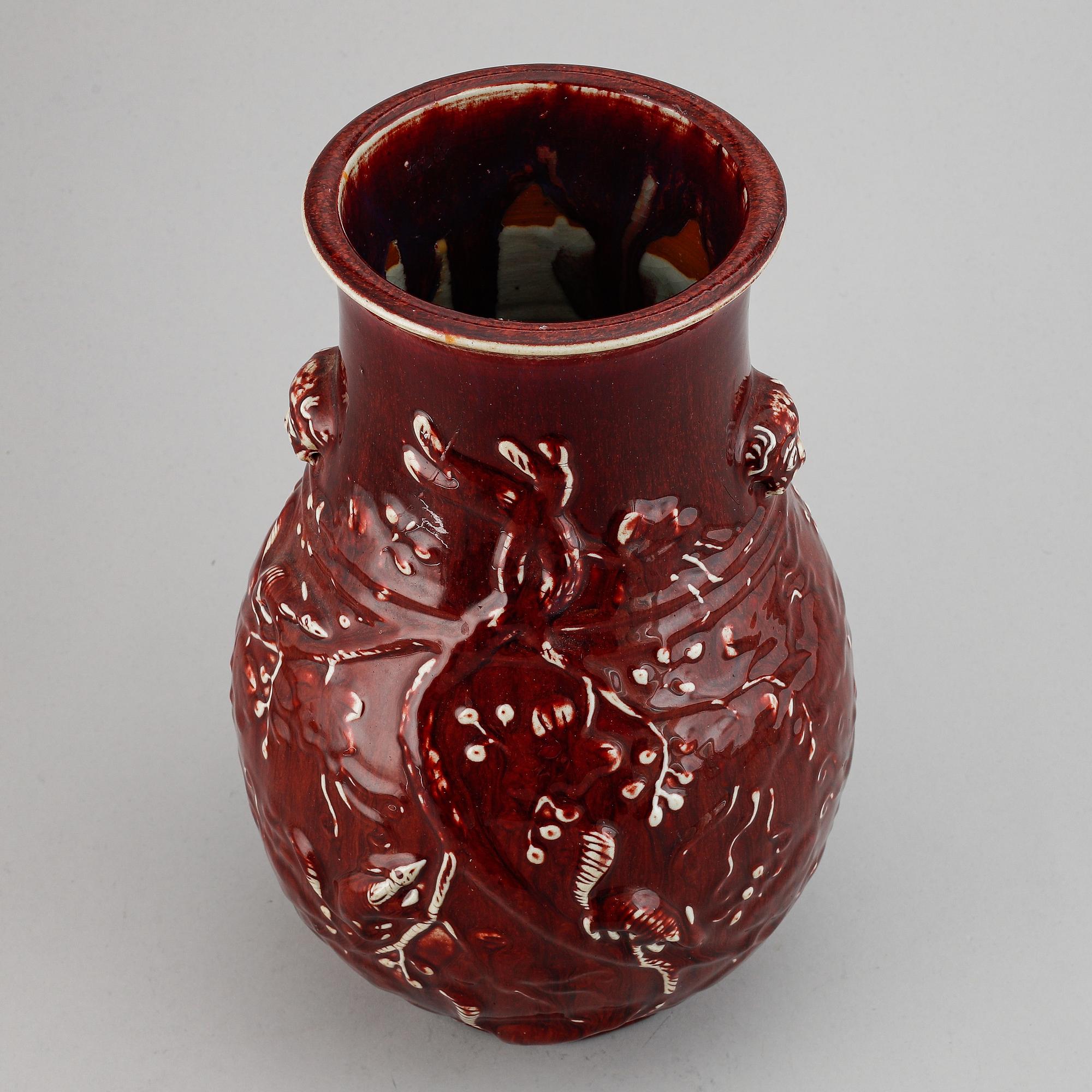 A red glazed Chinese vase, 20th century.
