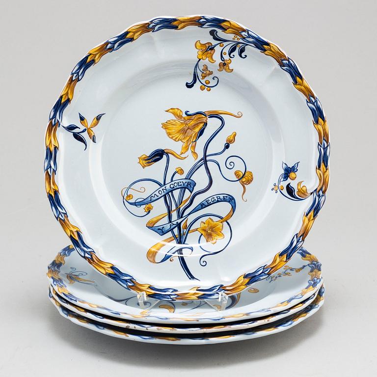 A set of four french faience cabinet plates signed Emile Gallé, Nancy. C. 1900.