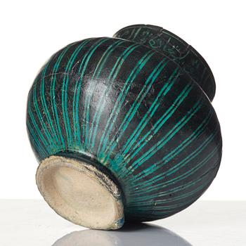 A Kashan Silhouette ware turquoise glazed pottery jug, central Iran, circa 1200.