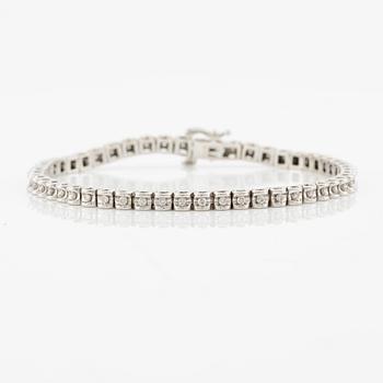 Tennis bracelet, 14K white gold and brilliant-cut diamonds.