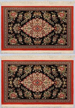 A pair of Tabriz rugs, part silk, so-called 50 Raj, 92 x 62 cm.