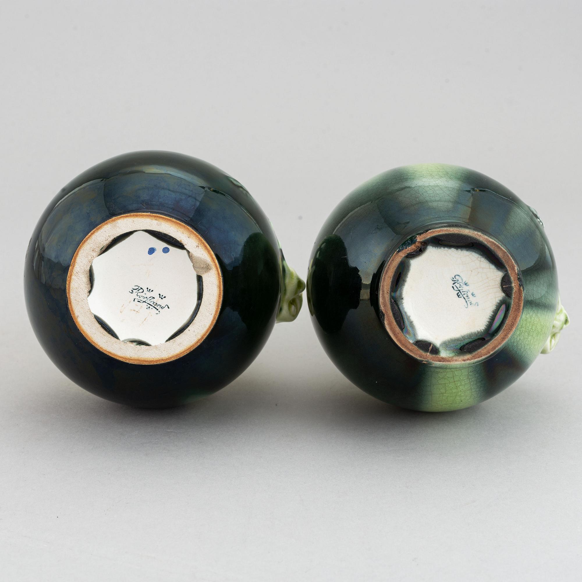 A pair of green glazed ceramic vases decorated with a lizard and an insect, Rörstrand, Sweden. Early 20th century.