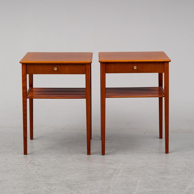 a pair of mahogany bedside tables.