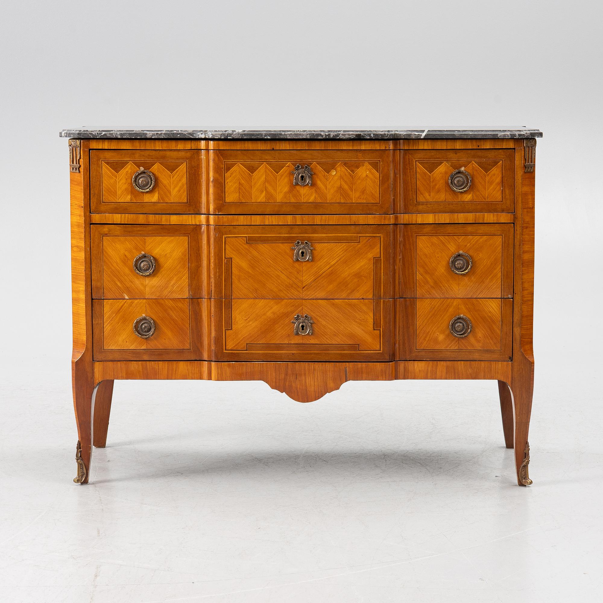 A Louis XVI style chest of drawers, France, circa 1900.
