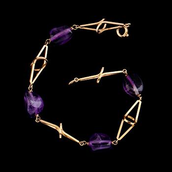 ARMBAND, 18 k guld med ametister. Total vikt med stenar ca 8 gram.
