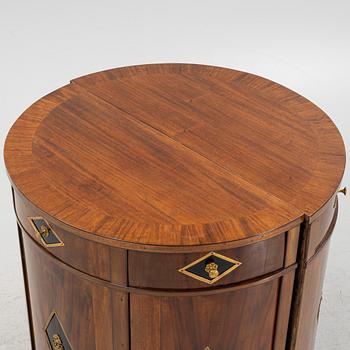 A pair of mahogany veneered empire style cabinets.