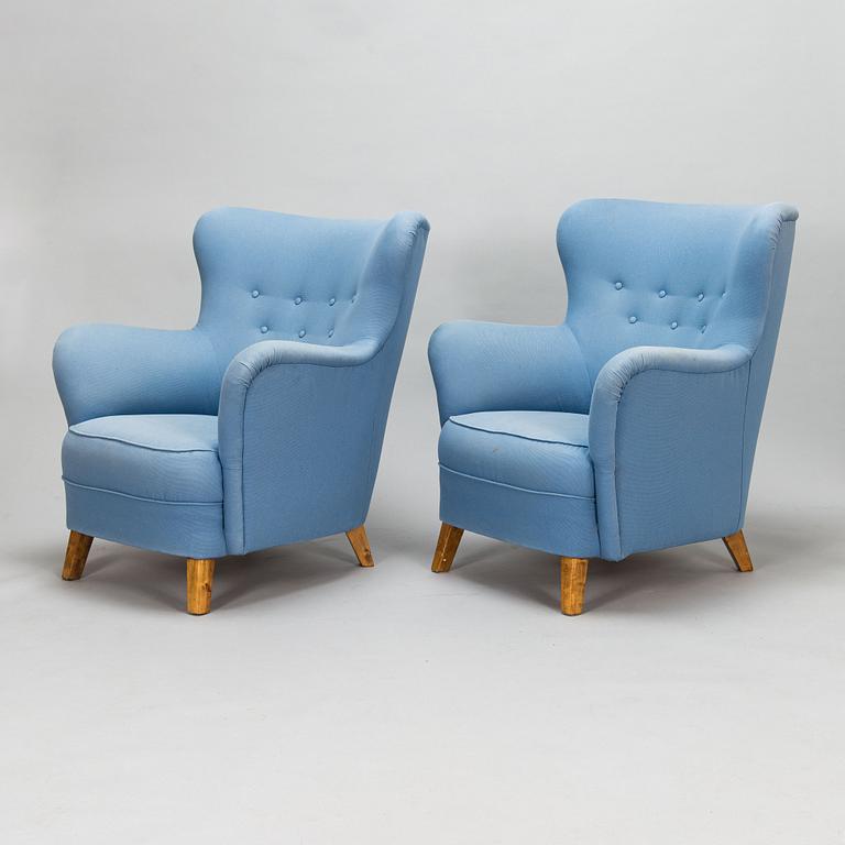 A pair of mid-20th-century armchairs.