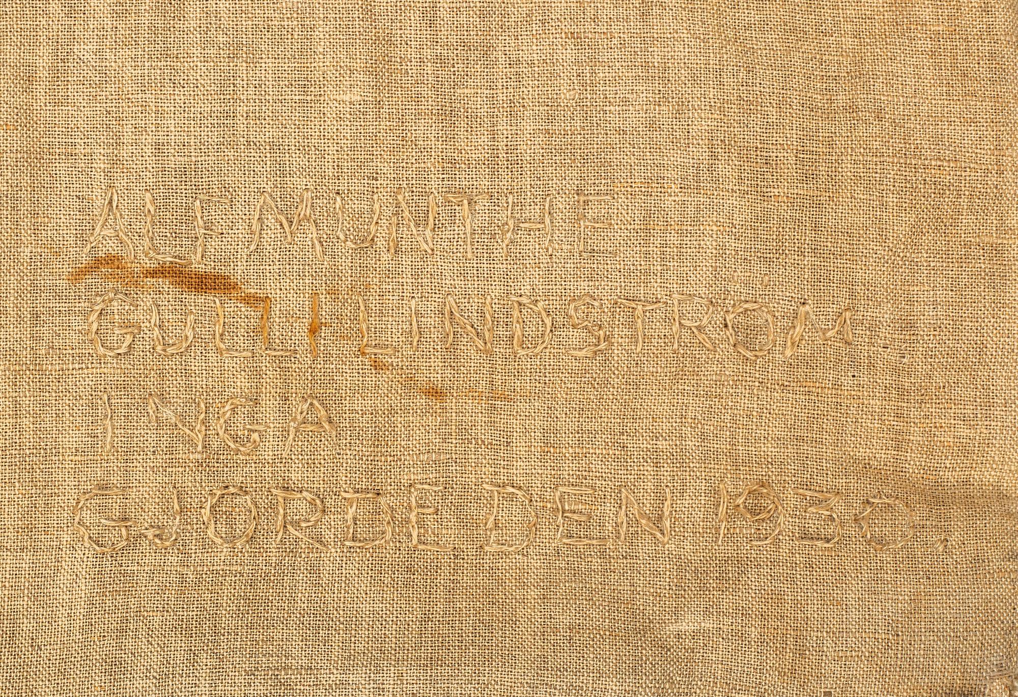 Alf Munthe, a textile, "Välkommen", embroidery and pile on fabric, ca 244,5 x 87-89 cm.