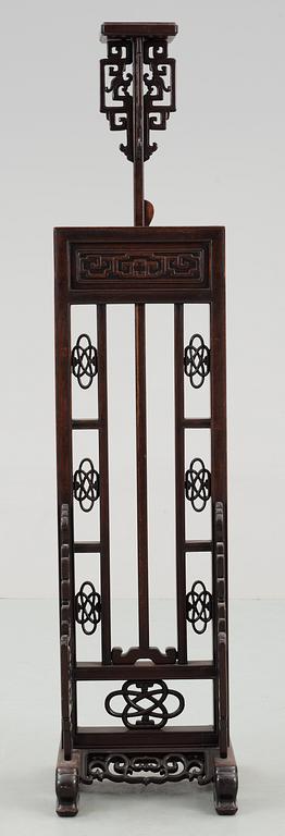 A hardwood lantern stand, with carved stylized dragons, presumably late Qing dynasty.