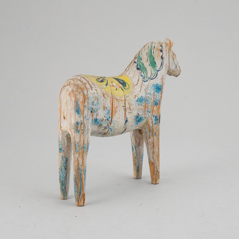 A painted Swedish wooden horse from the early 20th century.