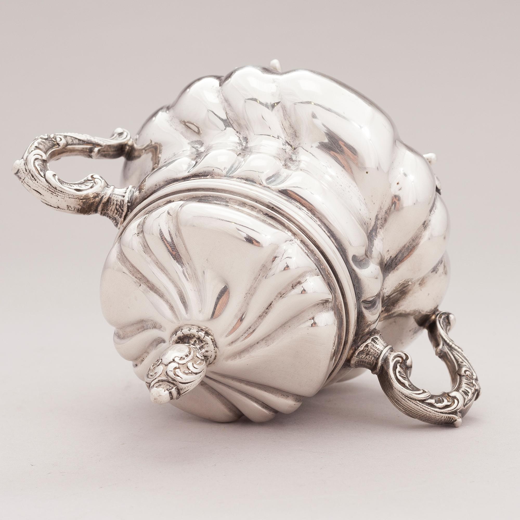 A lidded silver sugar bowl and a set of six silver bowls, Germany.