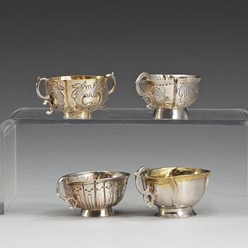 Four Russian 18th century parcel-gilt vodka-cups, three unmarked.