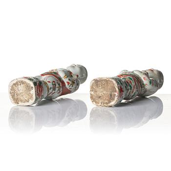 Three Chinese famille verte figures of laughing boys 'Hehe Erxian', 18th century.