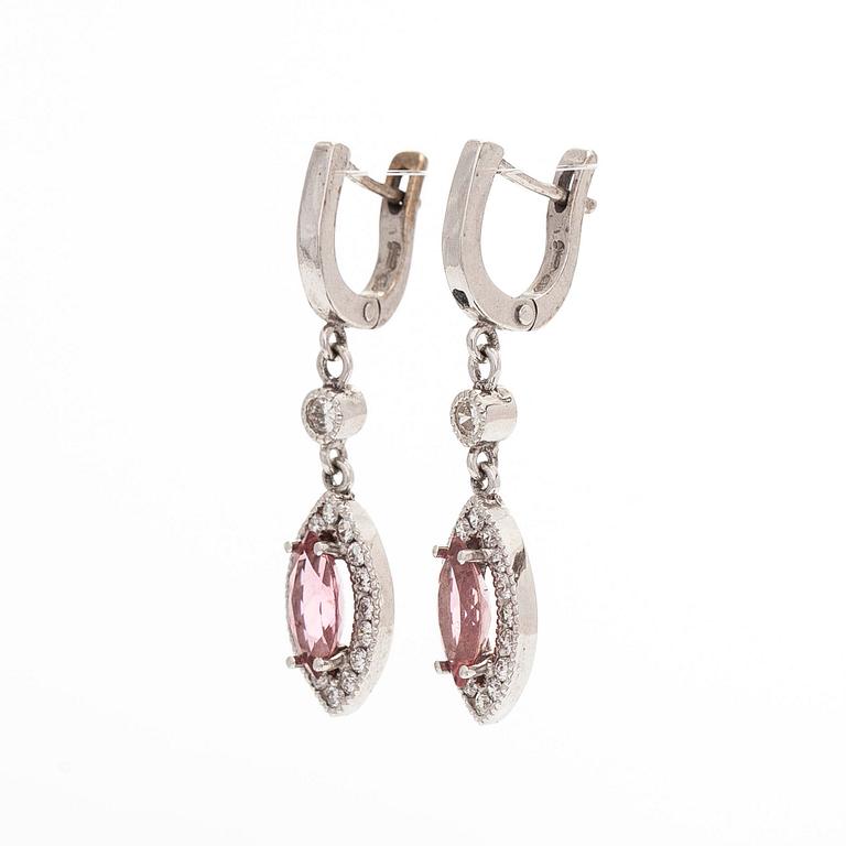 A pair of 14K white gold earrings, set with brilliant-cut diamonds and pink tourmalines.