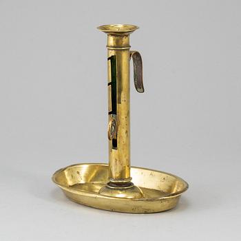 A 19th century brass candlestick.