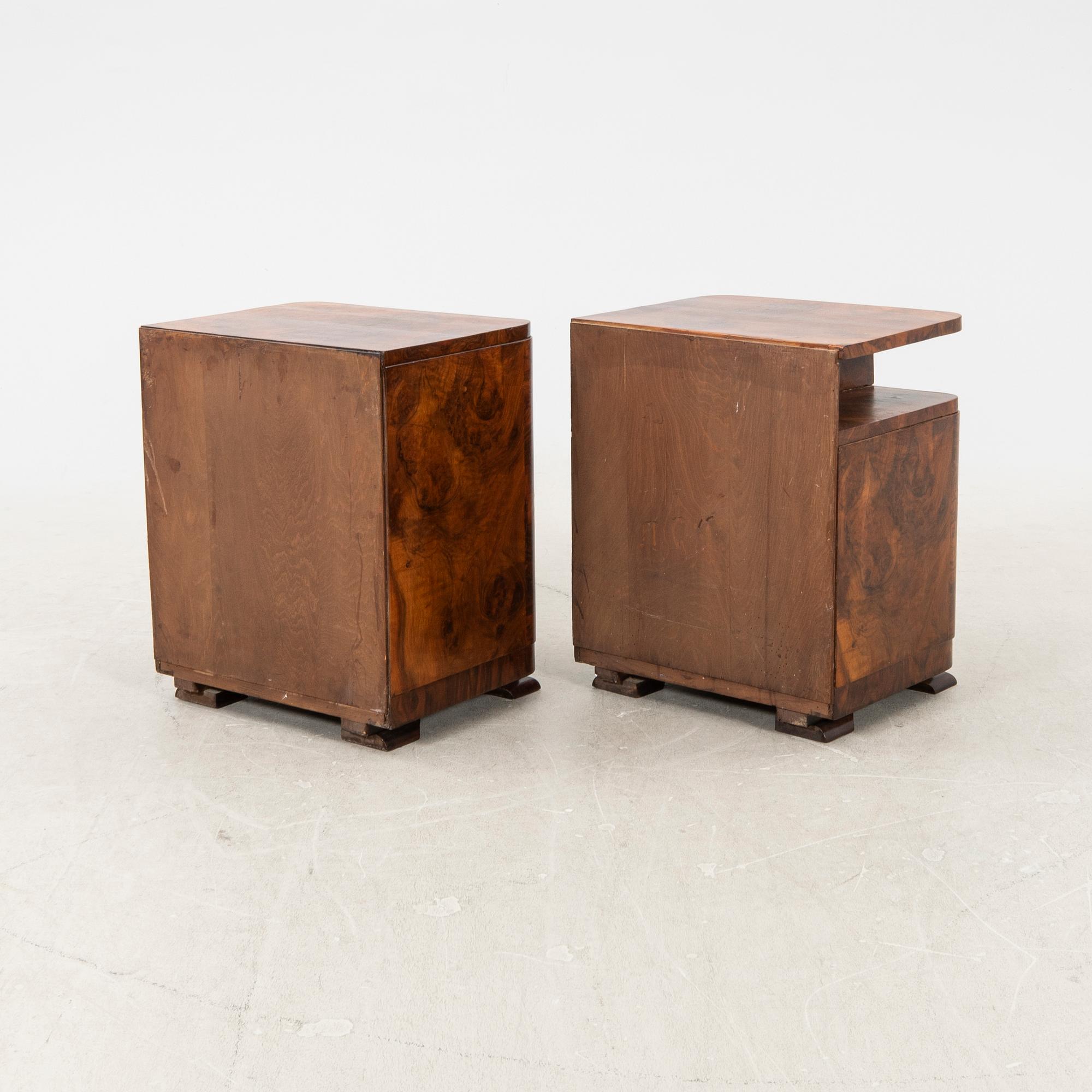 A pair of Art Deco walnut bedside tables.