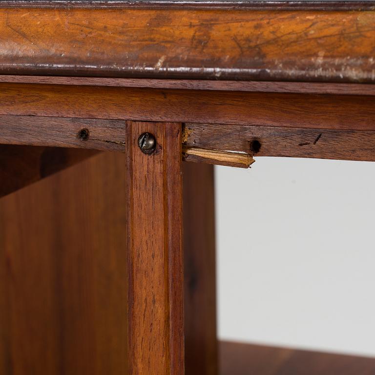 An early 20th century turning book shelf.