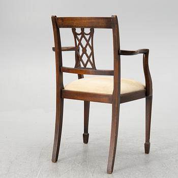 A mahogany and mahogany veneer desk with desk chair, 20th Century.