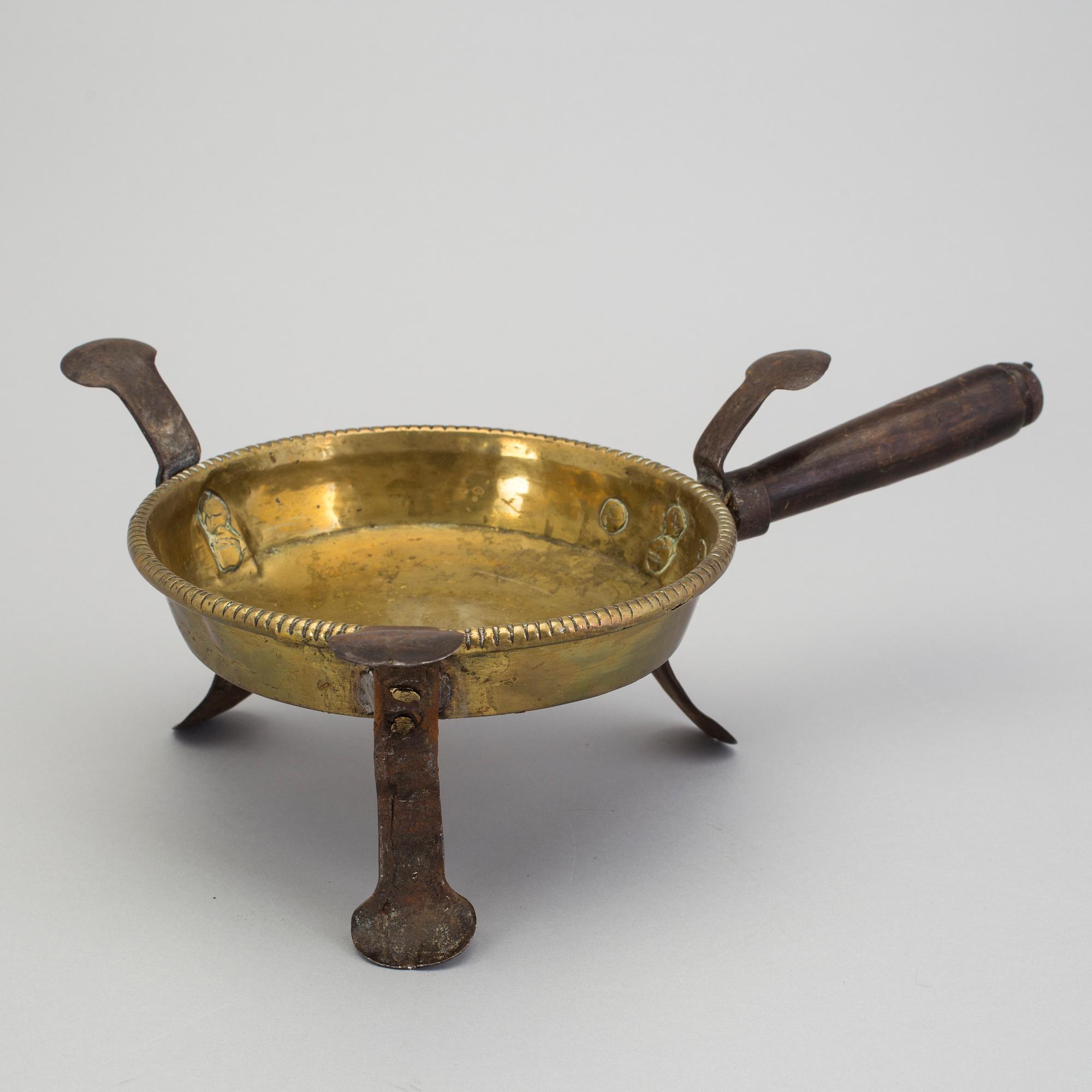 An 18th century brass brazier.