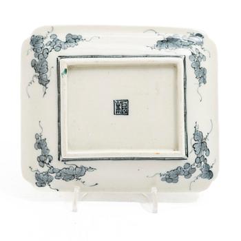 A small Japanese gilt copper box with cover and a porcelain dish, 19th century.