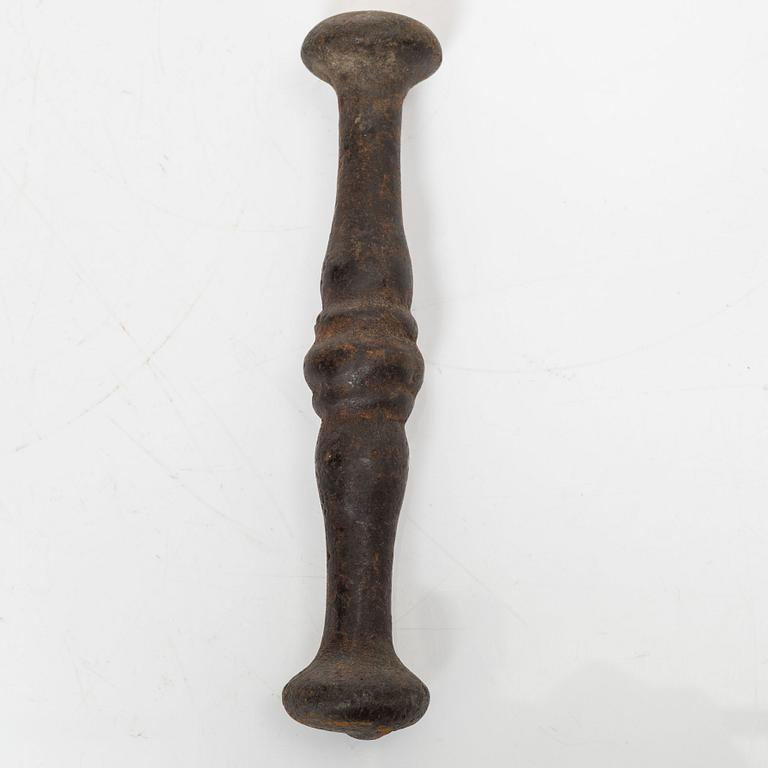 A cast-iron mortar and pestle of renaissance-type, 17th century.