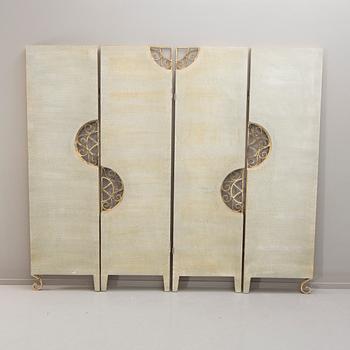 A 21st century metal and wood folding screen.