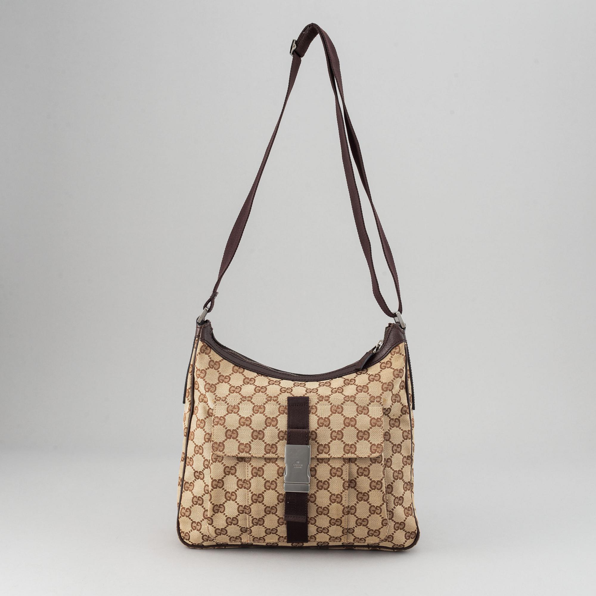 Gucci, a monogram canvas messenger bag.