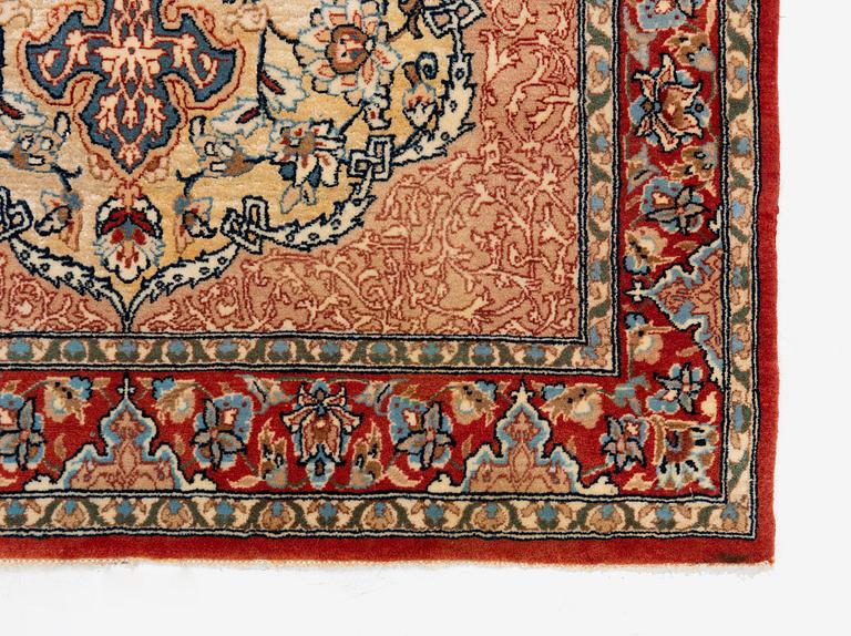 A semi-antique Isfahan rug, central Iran, part silk, signed (Mohammed) Seirafian, c. 120 x 70 cm.