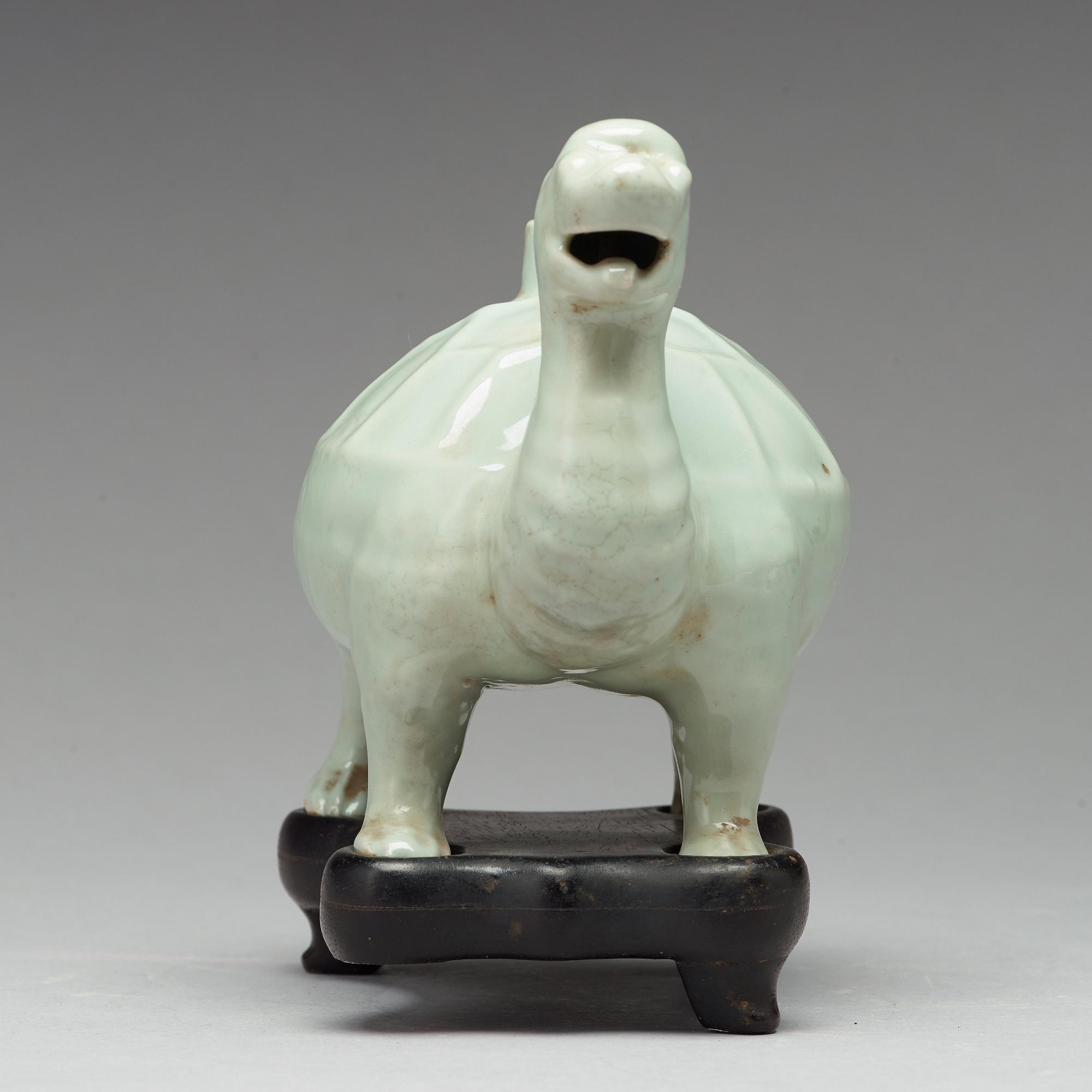 A celadon glazed water dropper, Qing dynasty (1644-1912).