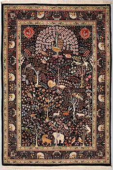 A Täbriz rug, part silk, signed, 255 x 172 cm.