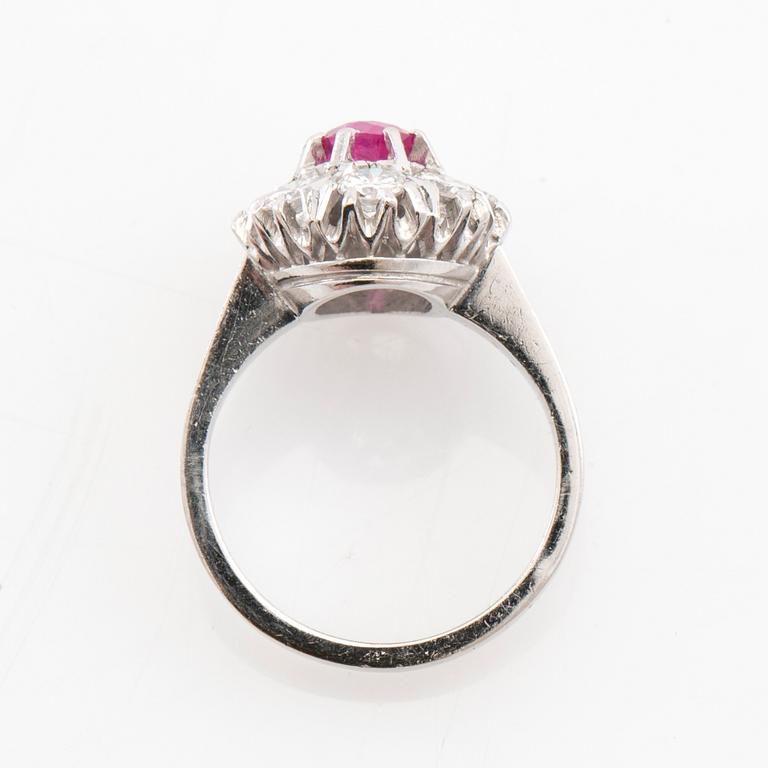 Ring Carmosé 18K white gold with an oval faceted ruby and round brilliant-cut diamonds, Reutners Ystad 1974.