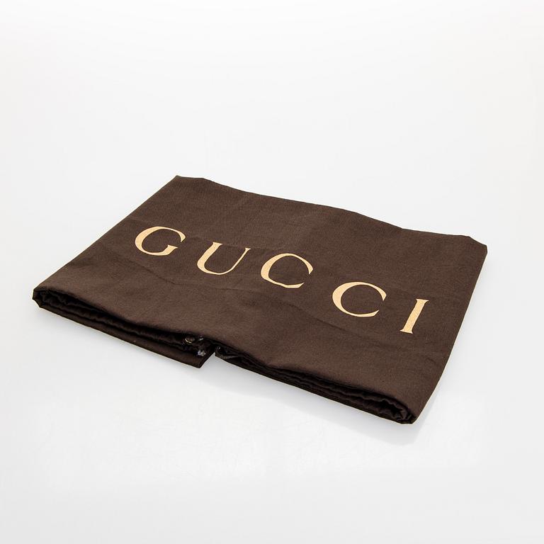 Gucci, an "Interlocking G" bag.