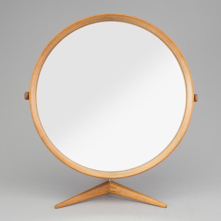 A Swedish 1960s mirror with stand, design Uno and Östen Krstiansson for Luxus Vittsjö.