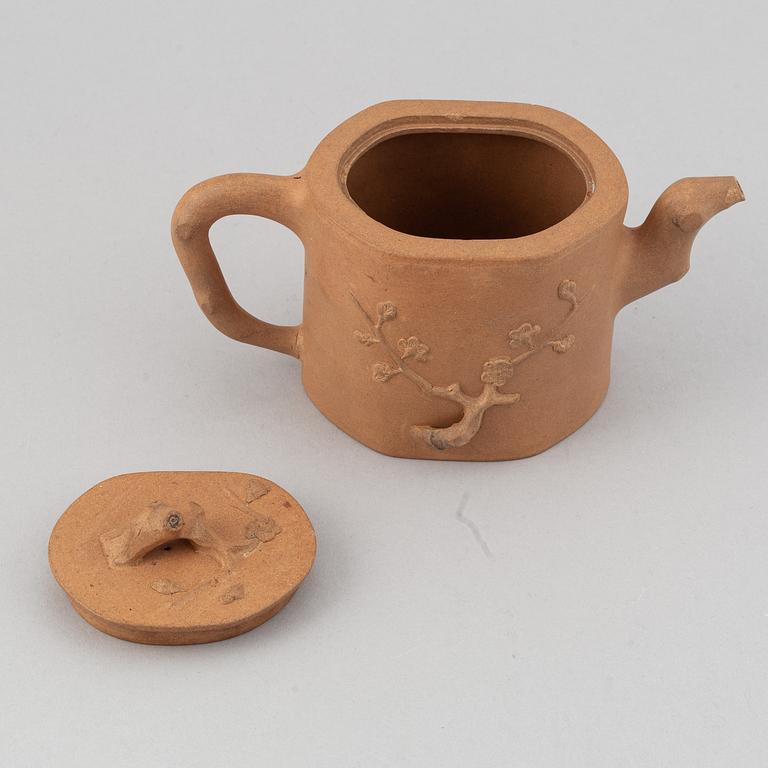 A Yixing pottery tea pot with cover, China, 20th Century, with seal mark.