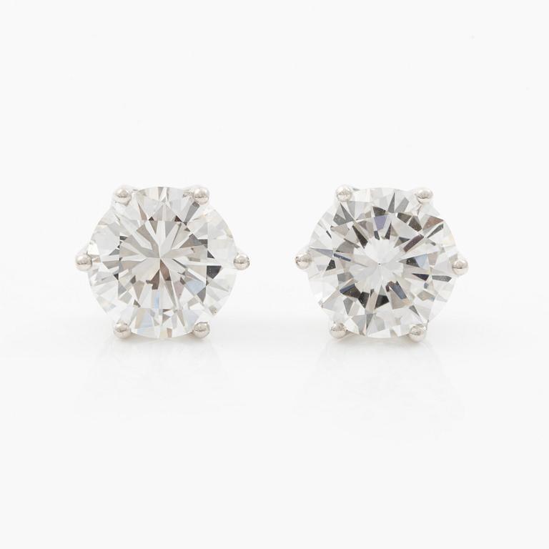 Earrings, single-stone earrings in 18K white gold with brilliant-cut diamonds, accompanied by IGI report.