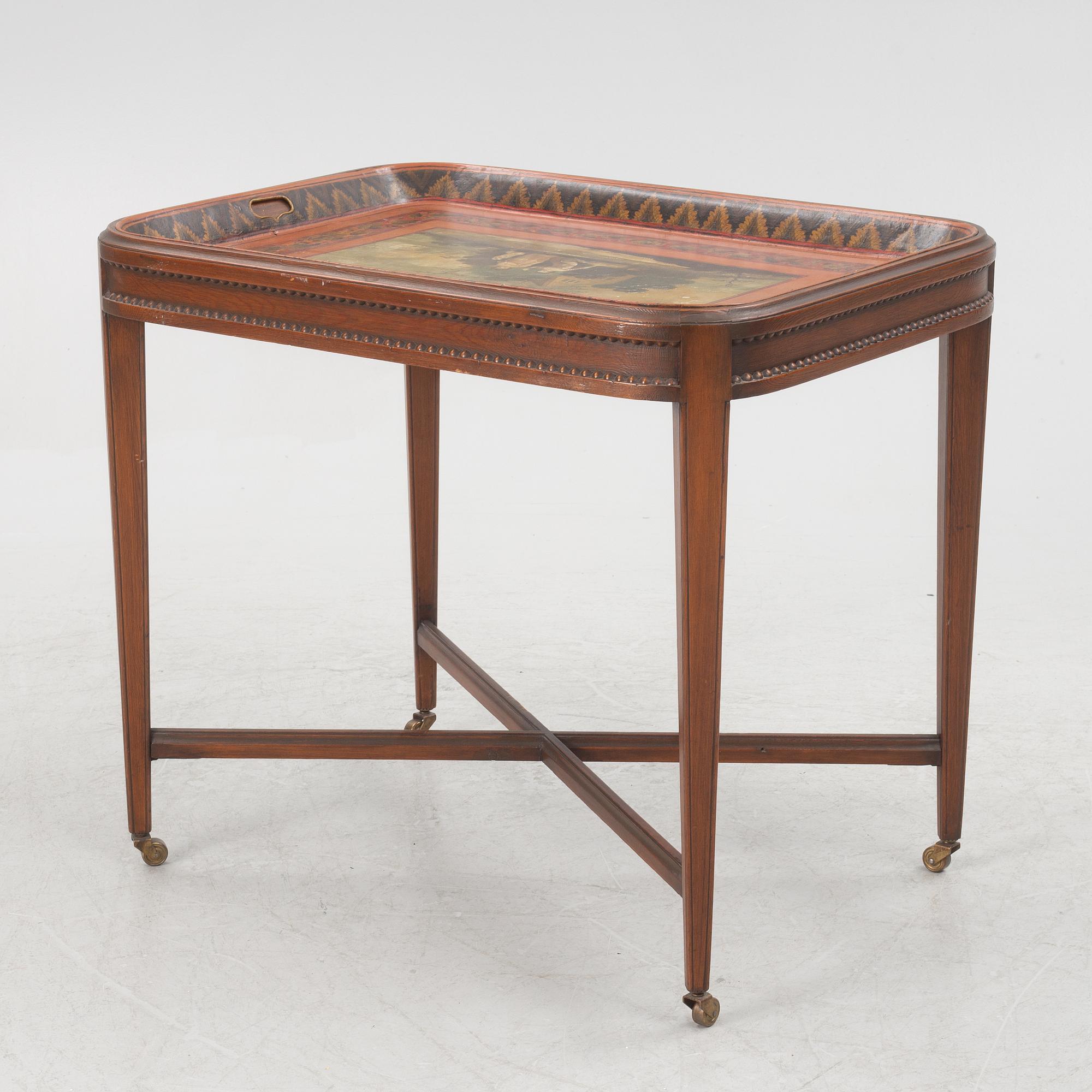 A painted tin tray 19th century with later stand.