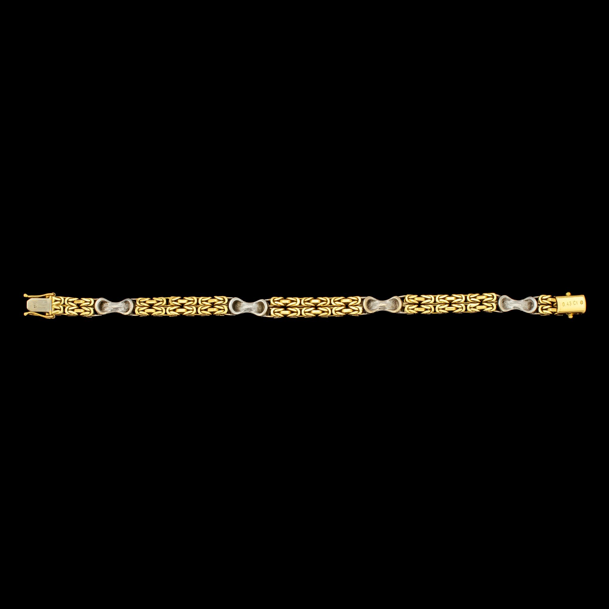 ARMLÄNK, 18k guld och vitguld med 24 små briljantslipade diamanter, tot 0.43 ct, importstämplat. Vikt 28 g.