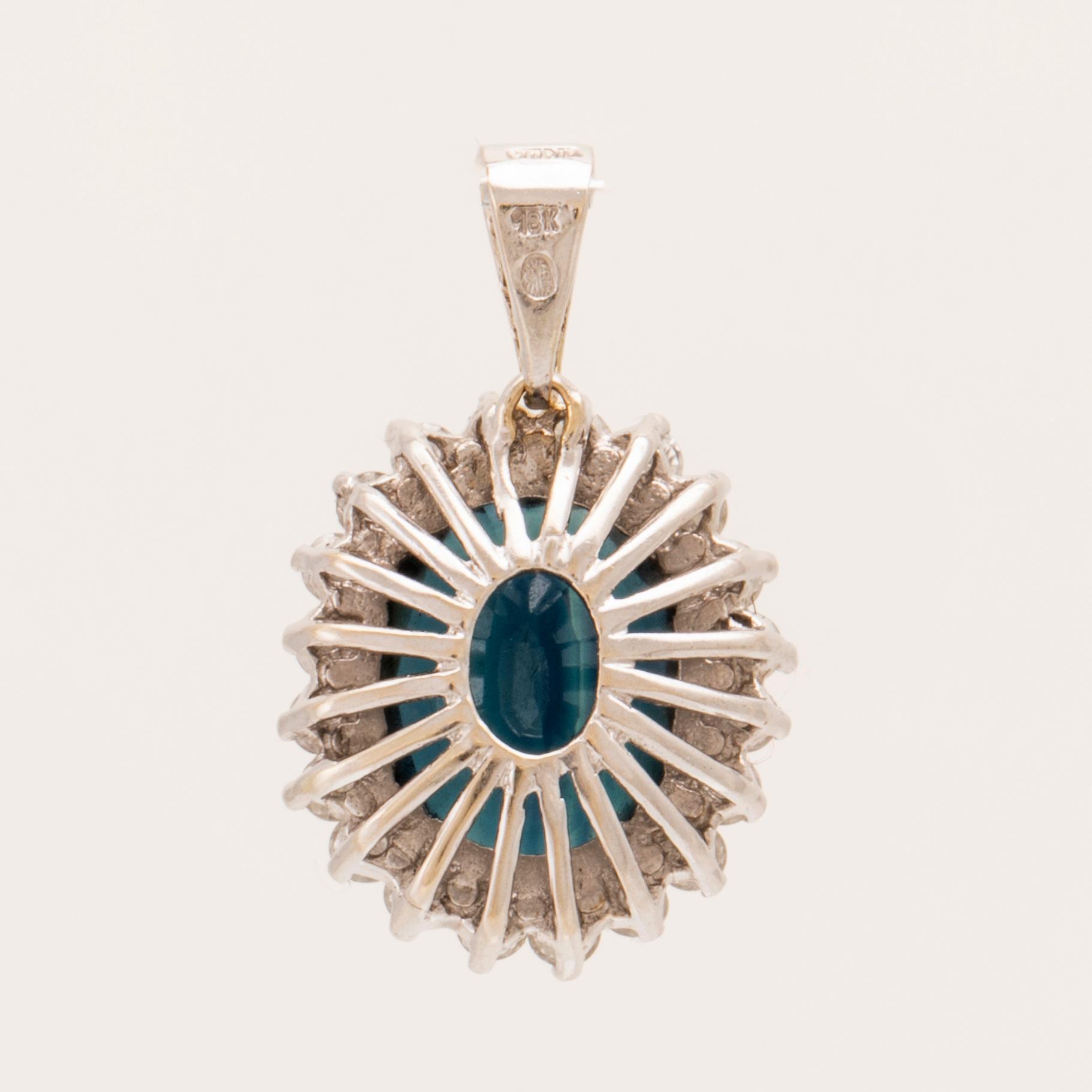 Pendant in 18K white gold with an oval faceted sapphire and round brilliant and single-cut diamonds.