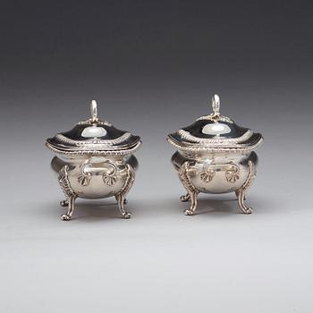 A pair of English 18th century silver sauce-tureens, marks of Sebastian & James Crespell, London 1772.