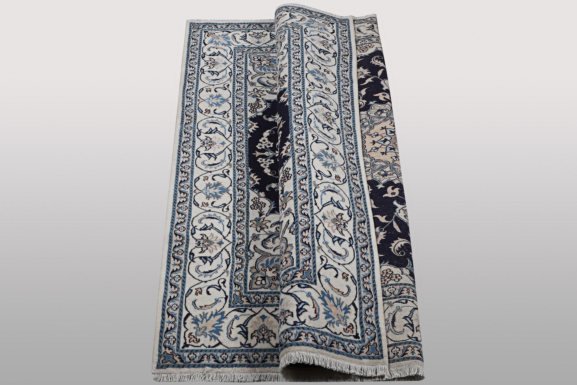 A carpet, Nain, part silk, ca 263 x 199 cm.