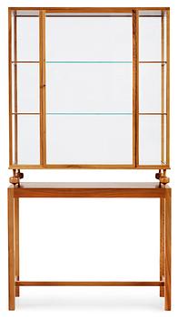 A Josef Frank walnut showcase cabinet, Svenskt Tenn, model 2077.