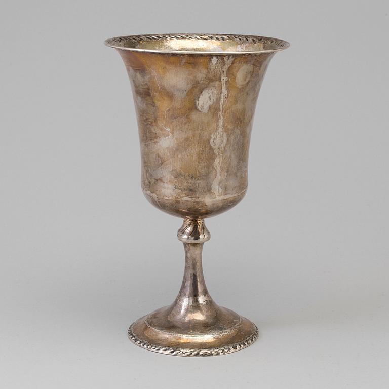 A silver cup dated 1923.